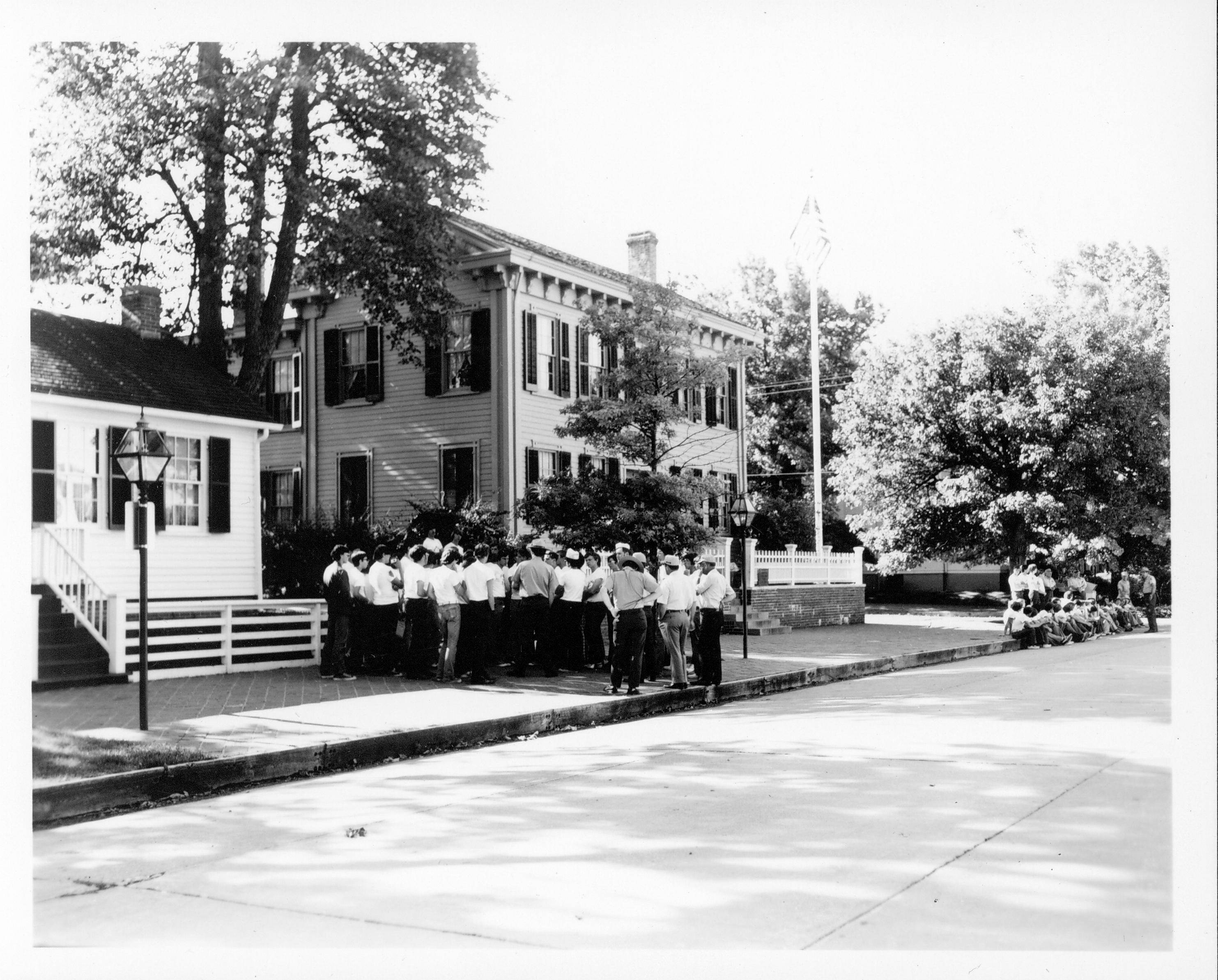 Lincoln Home - Walking Tours - 8th Street in front of the Lincoln Home See Class 1090; Class 8, Pic 4;Seasonal guides taking Boy's State on tour of House and area Interpretive Staff, 1973