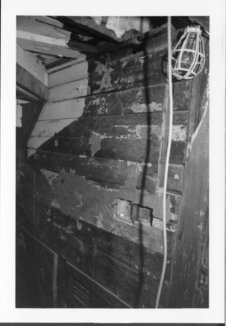 Detail of the north (right) wall of the Dining Room closet. The underside of the stairwell can be seen to the left of the photo. Image is sideways as of 3/30/25; to view properly, rotate 90 degrees clockwise (right). Photographer facing north west.
