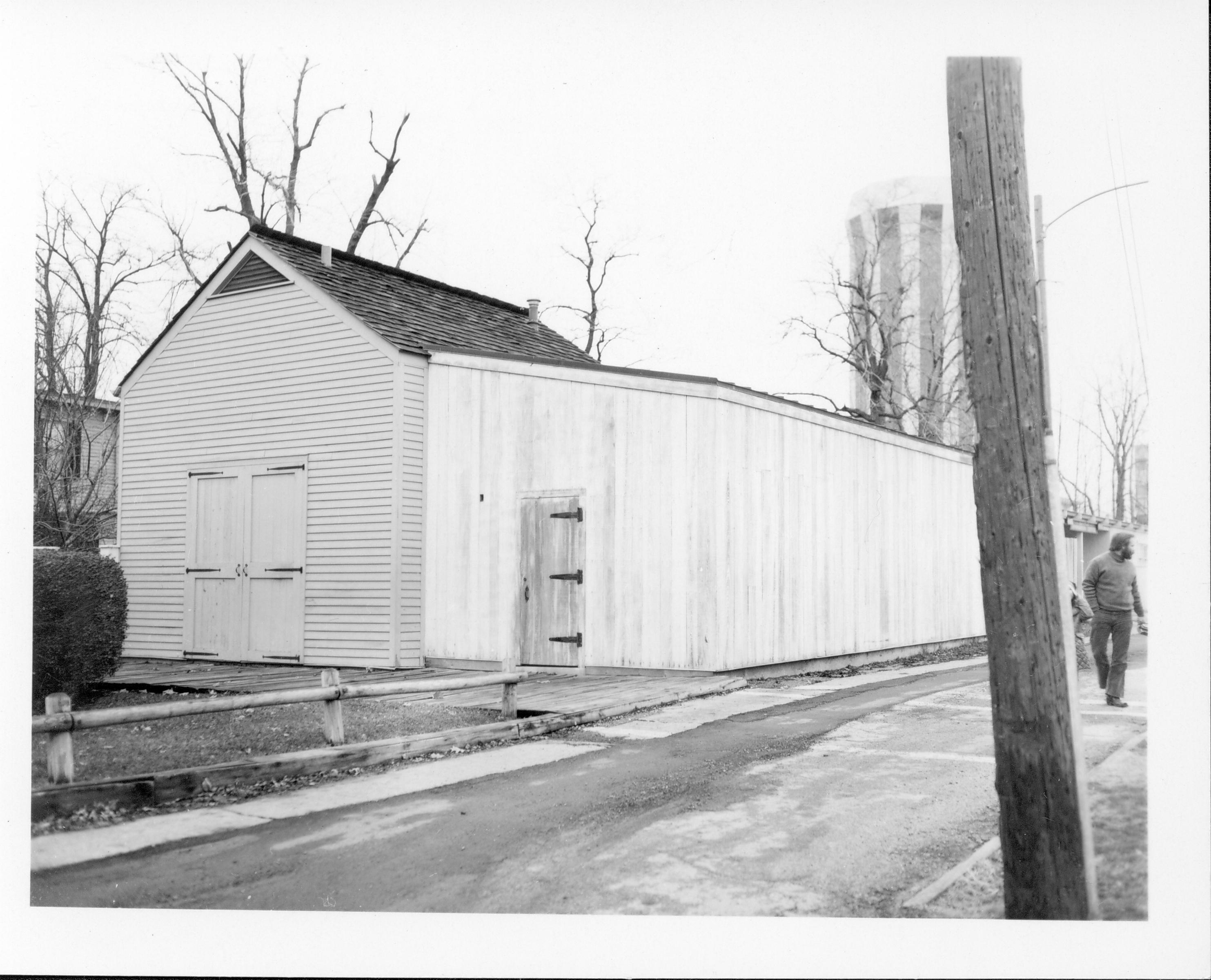 Lincoln Home carriage house and woodshed, with the Lincoln Home in the background. Photographer facing north west.